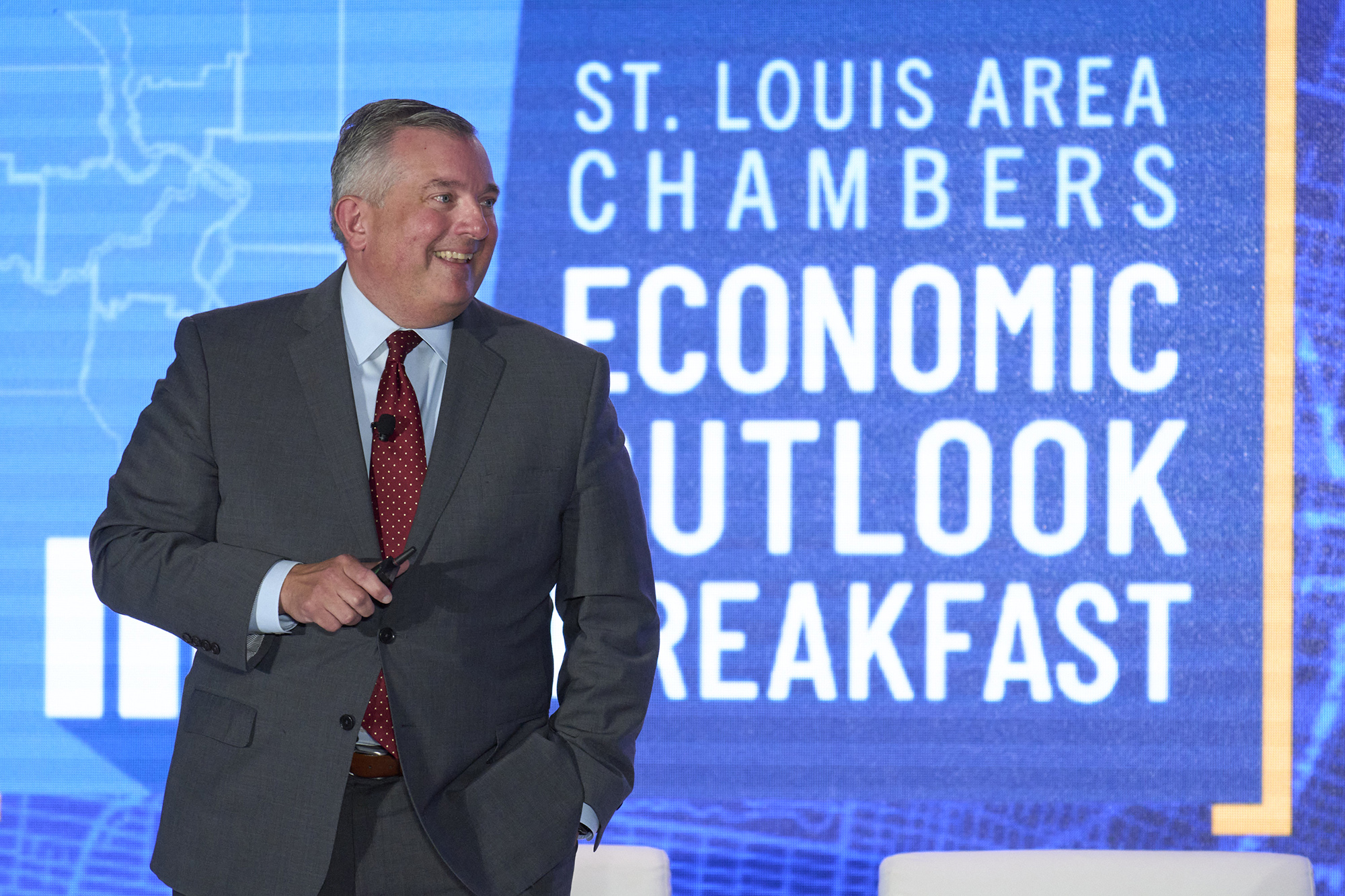 Neil Bradley of the U.S. Chamber of Commerce stands on the stage of the 2024 Economic Outlook Breakfast.