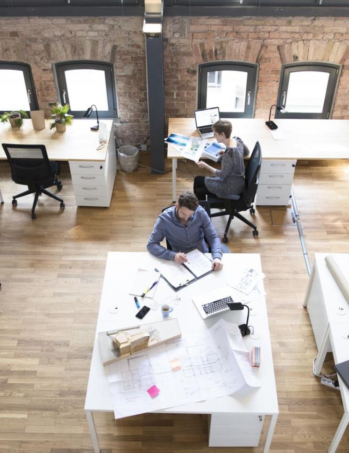 Overhead photo of people working in an office space