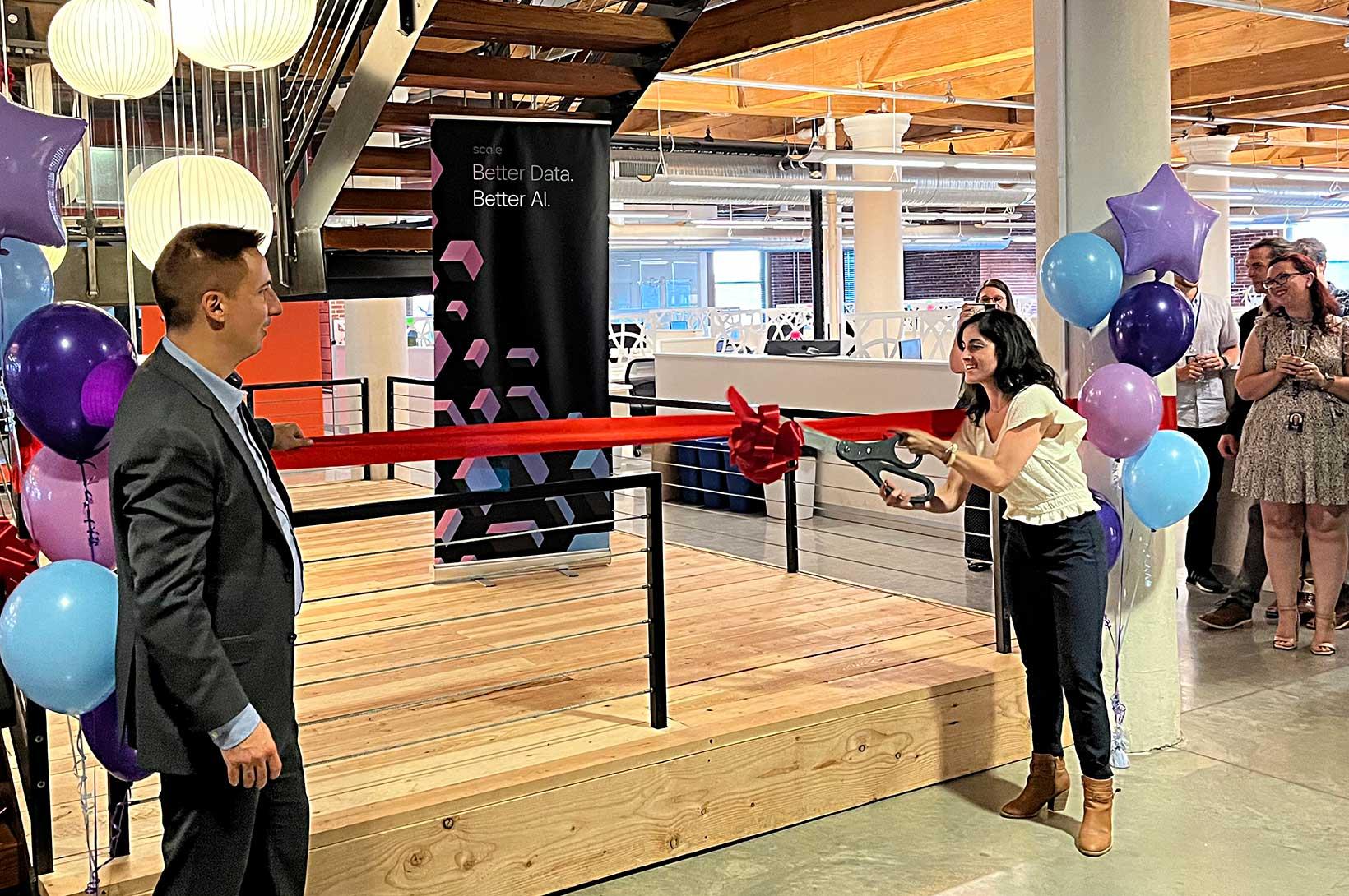 A ribbon cutting ceremony at Scale AI's new Downtown facility. 