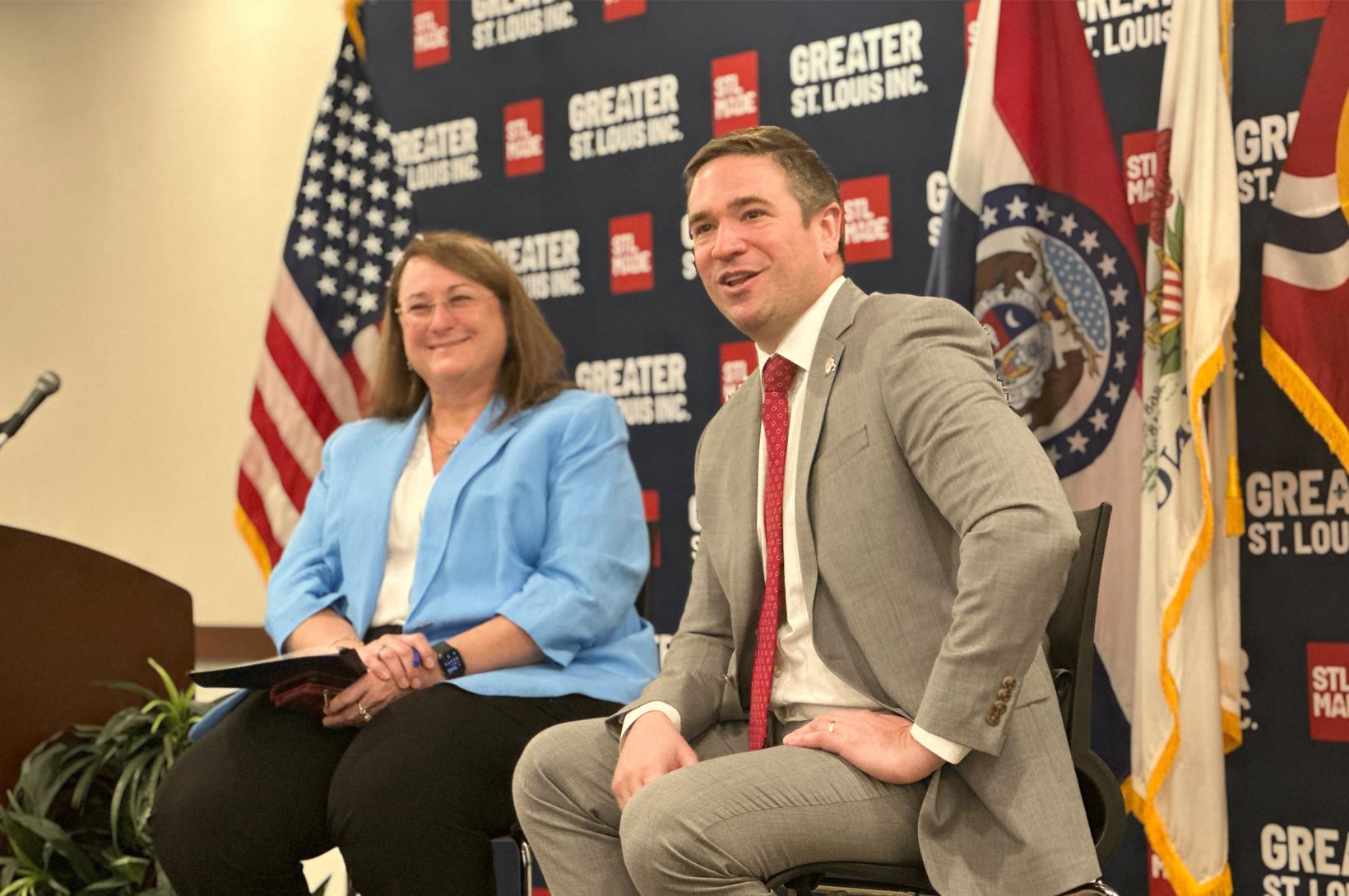 Missouri Attorney General Andrew Bailey addresses an audience at Greater St. Louis, Inc. alongside Tracy Henke.