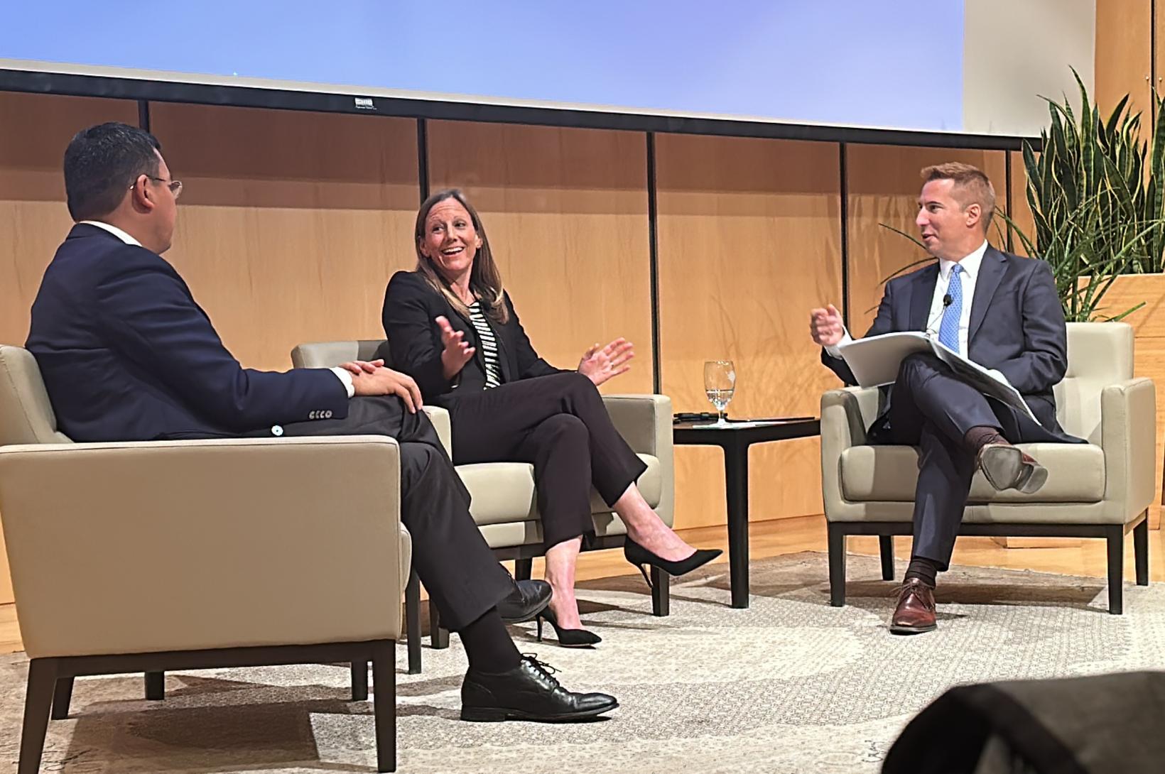 Three panelists on stage for a discussion at the Donald Danforth Plant Science Center.