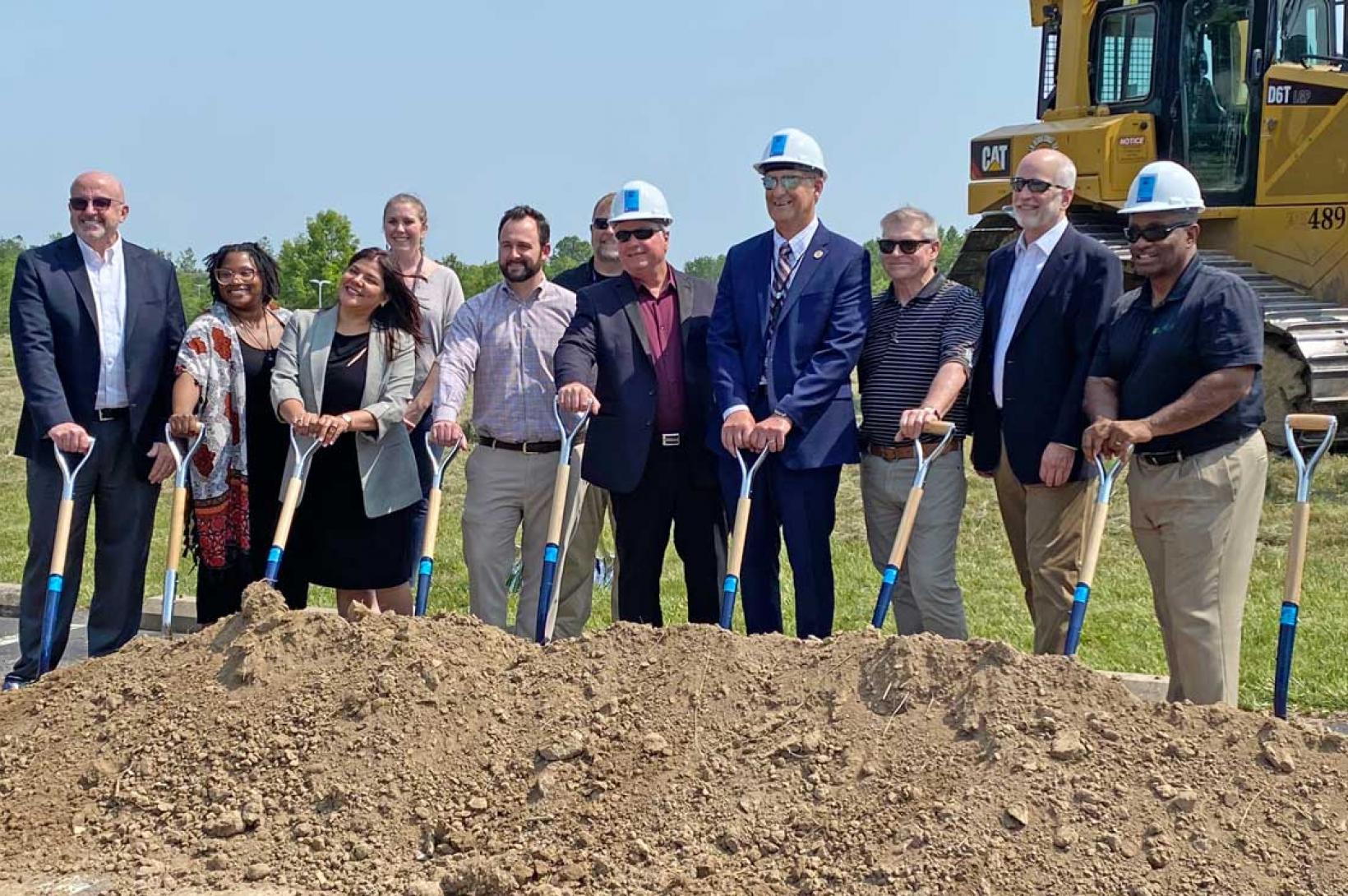 STLCC Groundbreaking: a line of St. Louis leaders holding shovels
