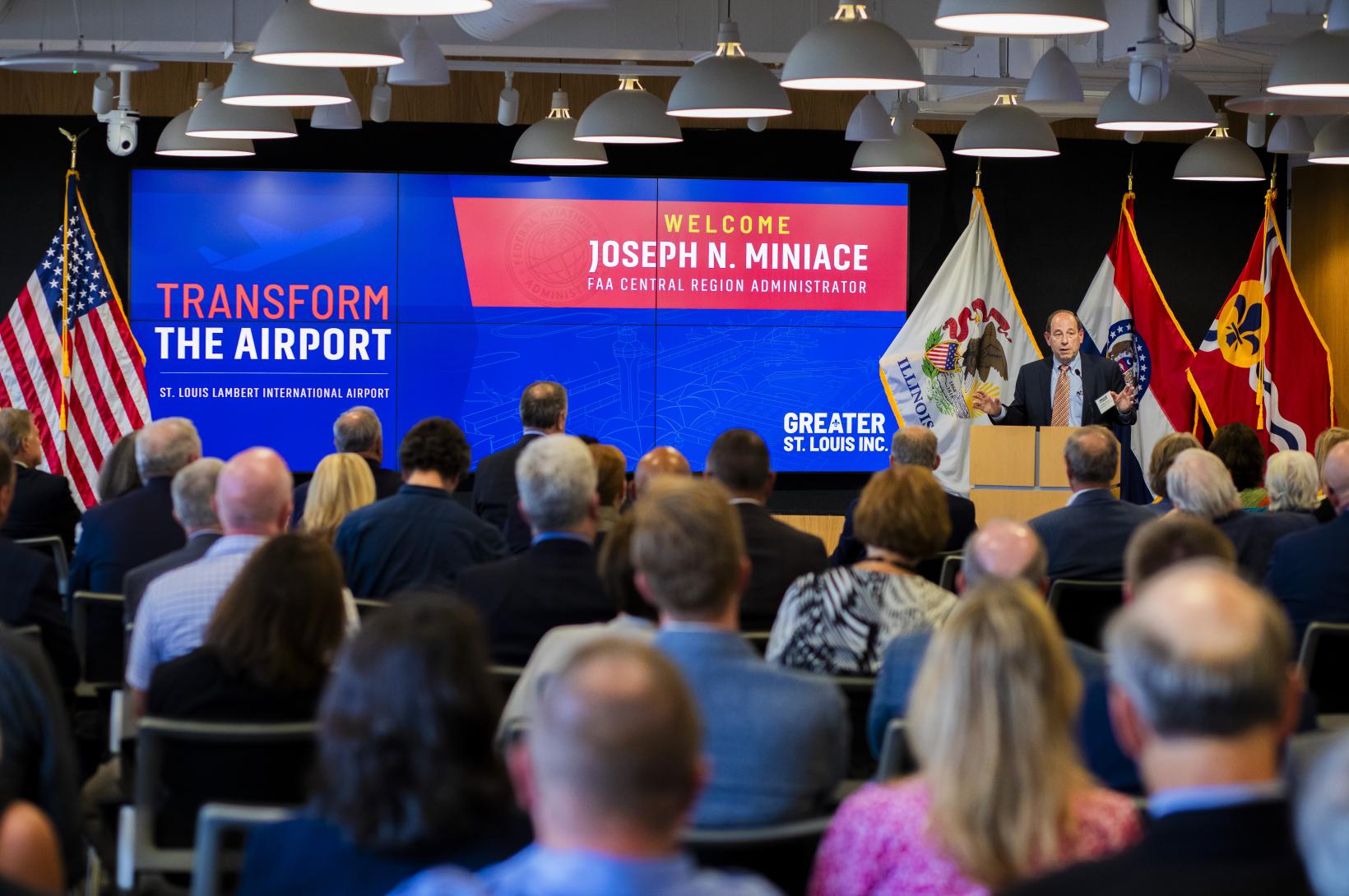Transform the Airport - newsroom Joseph Miniace speaks to an audience at Greater St. Louis, Inc.