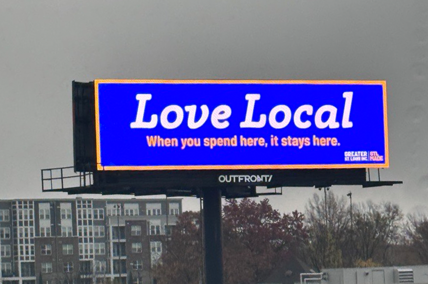 Love Local billboard 2024 A bright blue Love Local billboard reminds St. Louis shoppers to buy local.