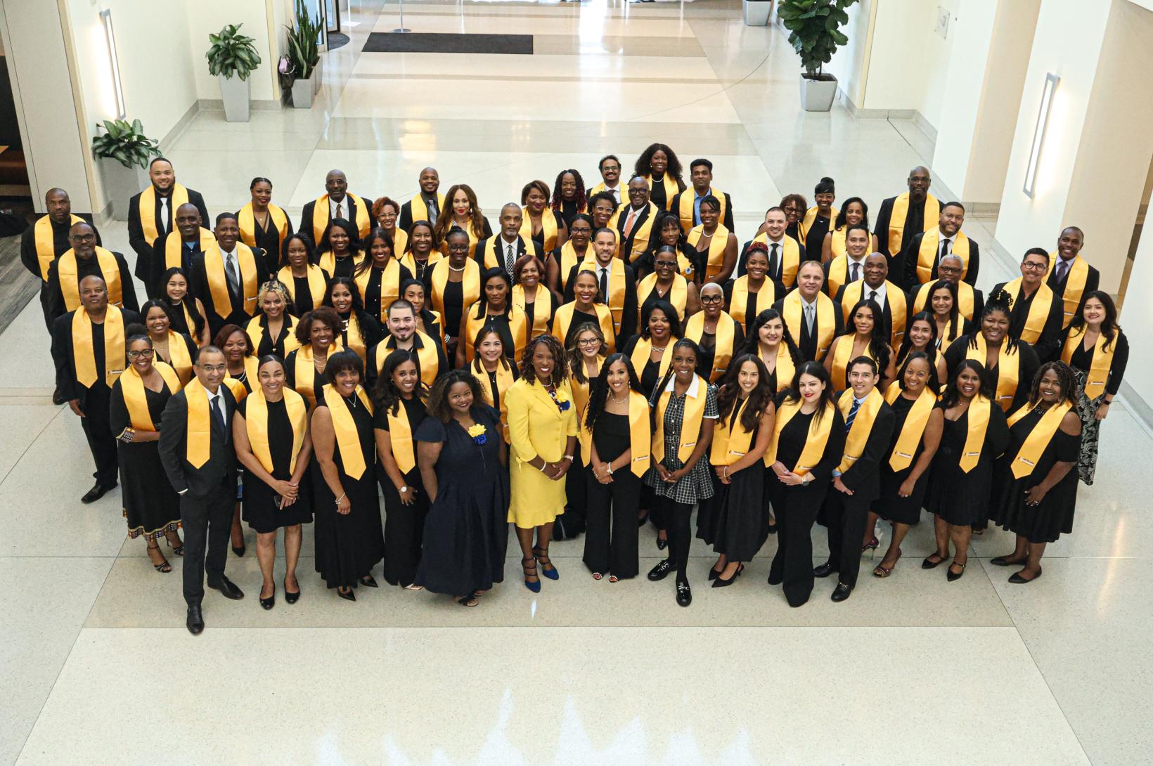 Fellows Experience - Cohort 19 The 19th cohort of the Fellows Experience poses for a photo during their graduation at Edward Jones