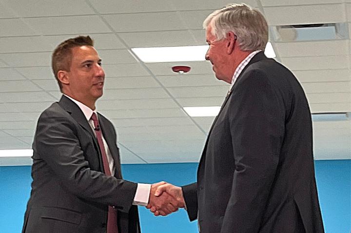 Jason Hall shaking hands with Governor Parson