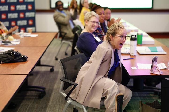 A professional woman — Letisha Wexstten — reacts with shock upon finding out she's the winner of the Final Pitch grand prize.