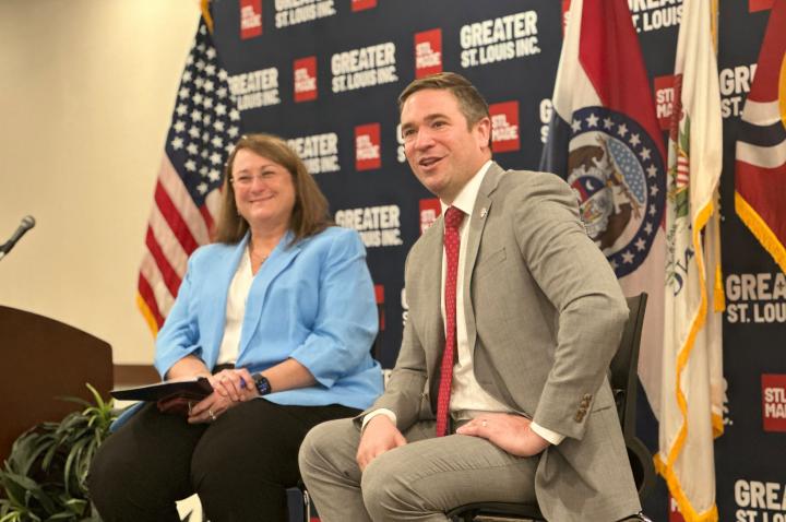 Missouri Attorney General Andrew Bailey addresses an audience at Greater St. Louis, Inc. alongside Tracy Henke.