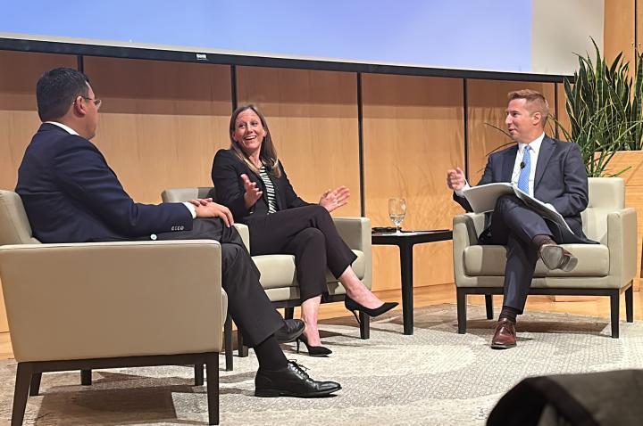 Three panelists on stage for a discussion at the Donald Danforth Plant Science Center.