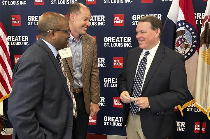 Congressman Sam Graves laughs to two Greater St. Louis, Inc. investors.