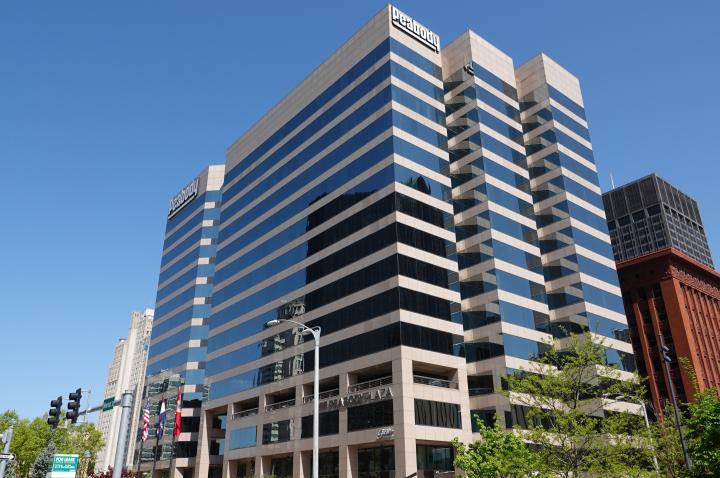 The Peabody building in Downtown St. Louis, set against a blue sky.