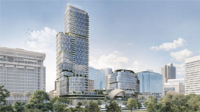 expansion Cluster of modern glass-clad mixed-use towers with staggered terraces and rooftop greenery rising behind a low curved pavilion, set against a downtown skyline with trees in the foreground