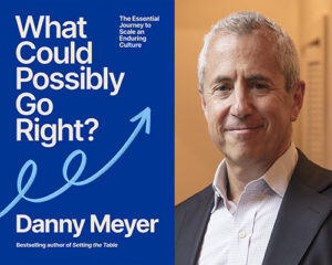 Book cover for What Could Possibly Go Right? by Danny Meyer beside a smiling man's headshot